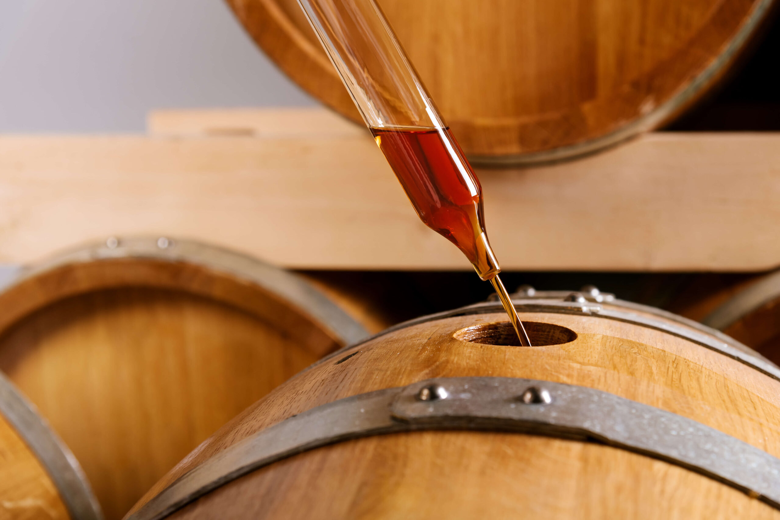 natural fruit essence balsamic poured into a wooden barrel ESSENCE Reserve